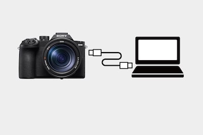 示意圖展示相機與電腦透過 USB 線連接